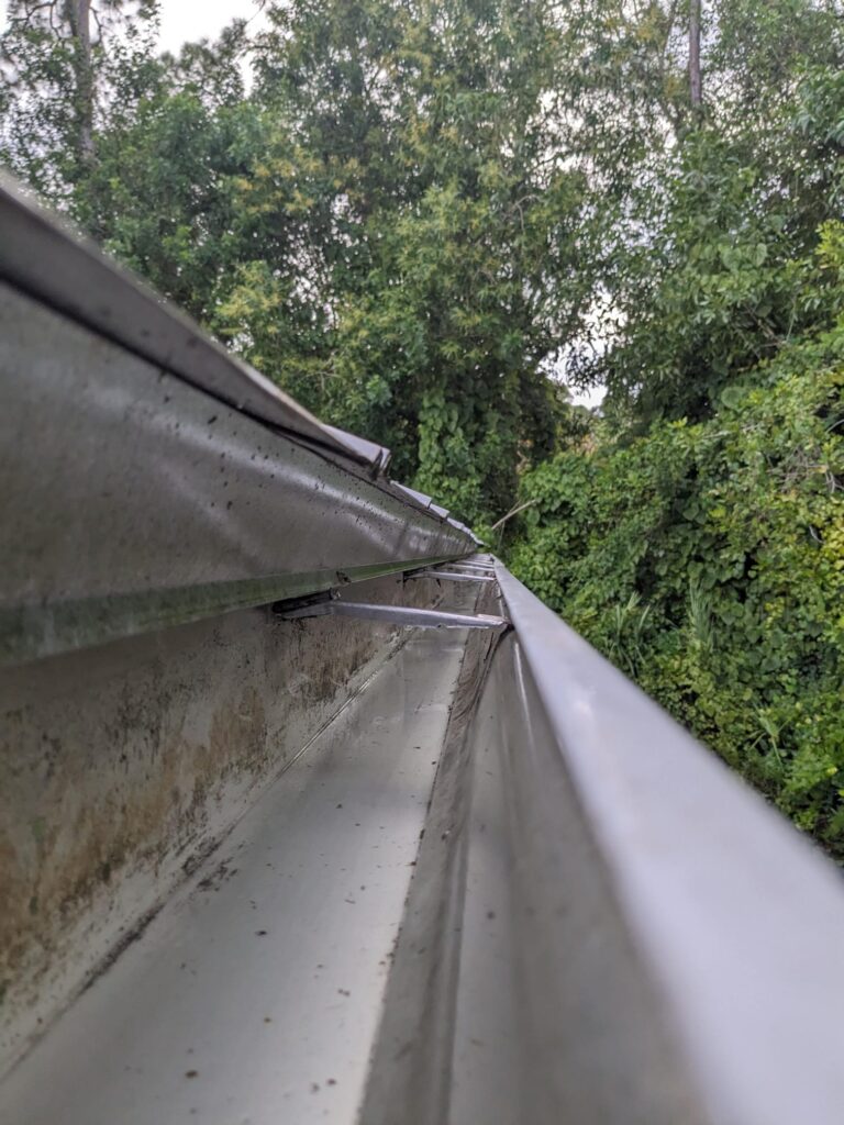 Clean gutters free of debris, with no clogs or leaks