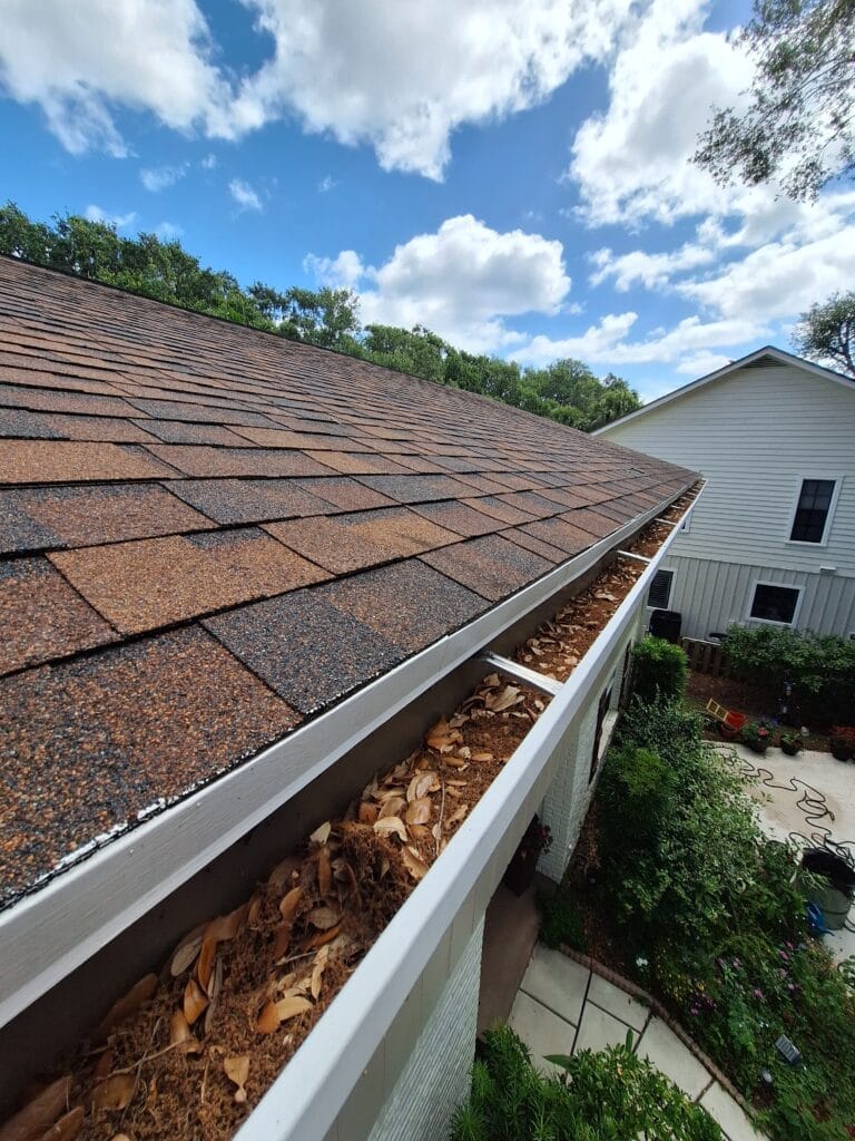 Before picture of eavestrough and gutter cleaning in Palm Beach County